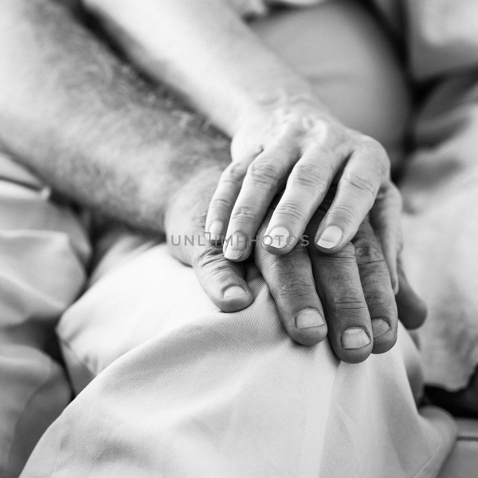 Senior couple holding hands by Wavebreakmedia