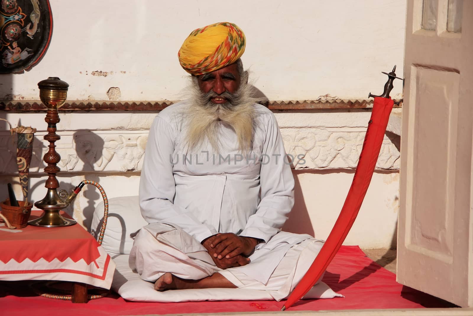 Indian man sitting at Mehrangarh Fort, Jodhpur, Rajasthan, India