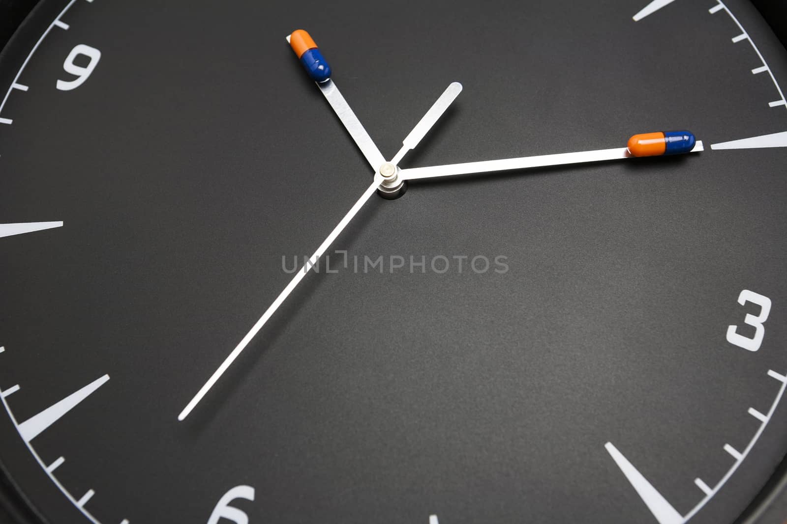 concept for Healthcare And Medicine, a clock marks the time of taking medicines