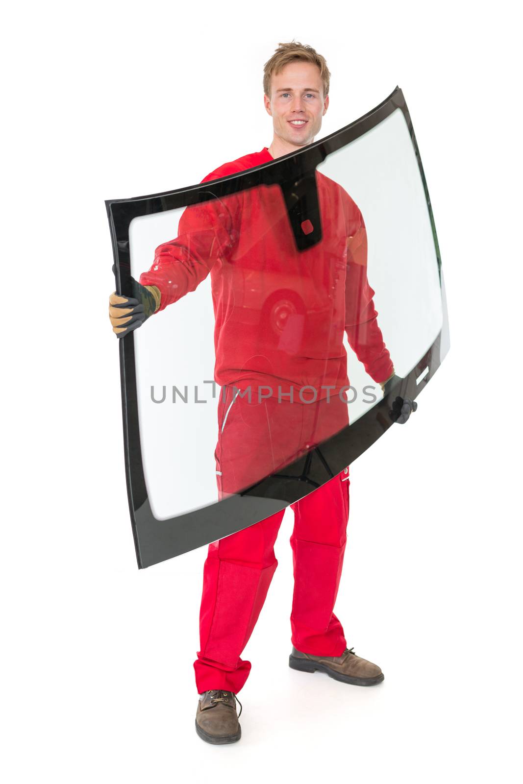 Worker glazier's workshop with car windscreen or windshield isolated in front of white background