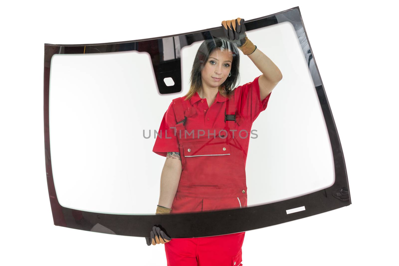 Worker glazier's workshop with car windscreen or windshield isolated in front of white background