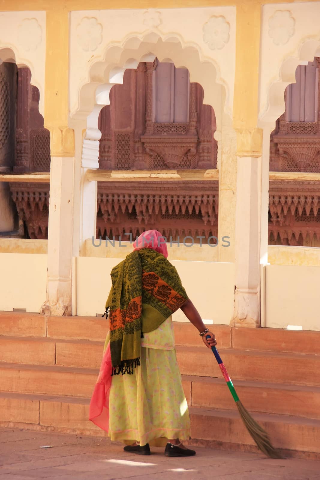 Indian woman sweeping floor, Mehrangarh Fort, Jodhpur, India by donya_nedomam