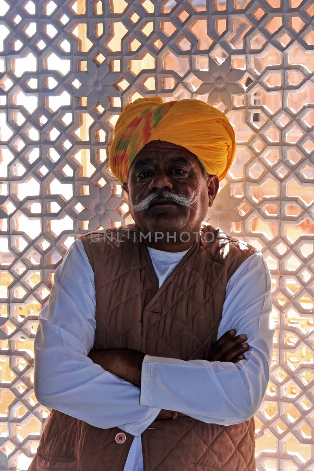 Indian man standing by the window at Mehrangarh Fort, Jodhpur, Rajasthan, India