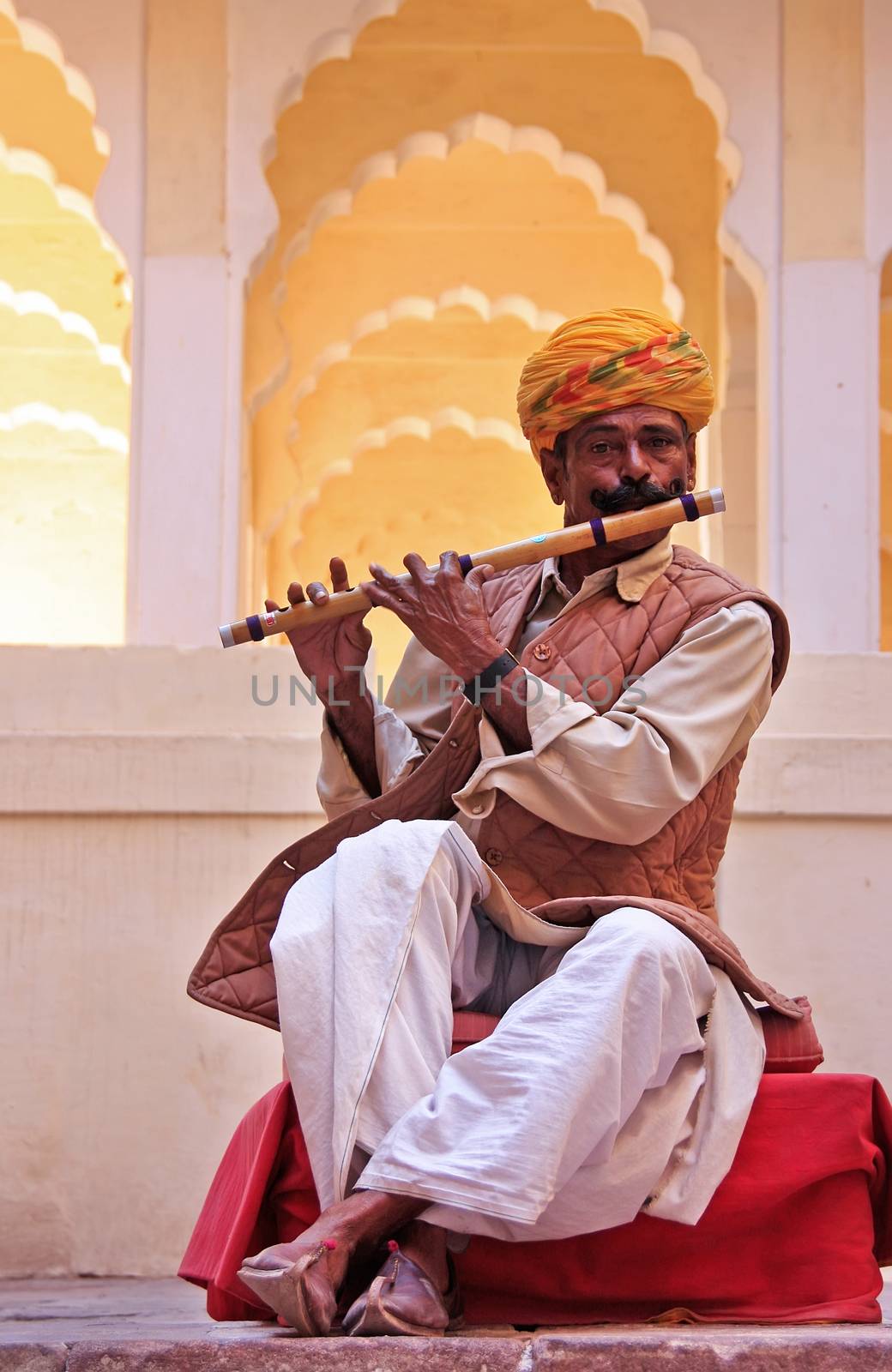 Indian man playing flute, Mehrangarh Fort, Jodhpur, Rajasthan, India