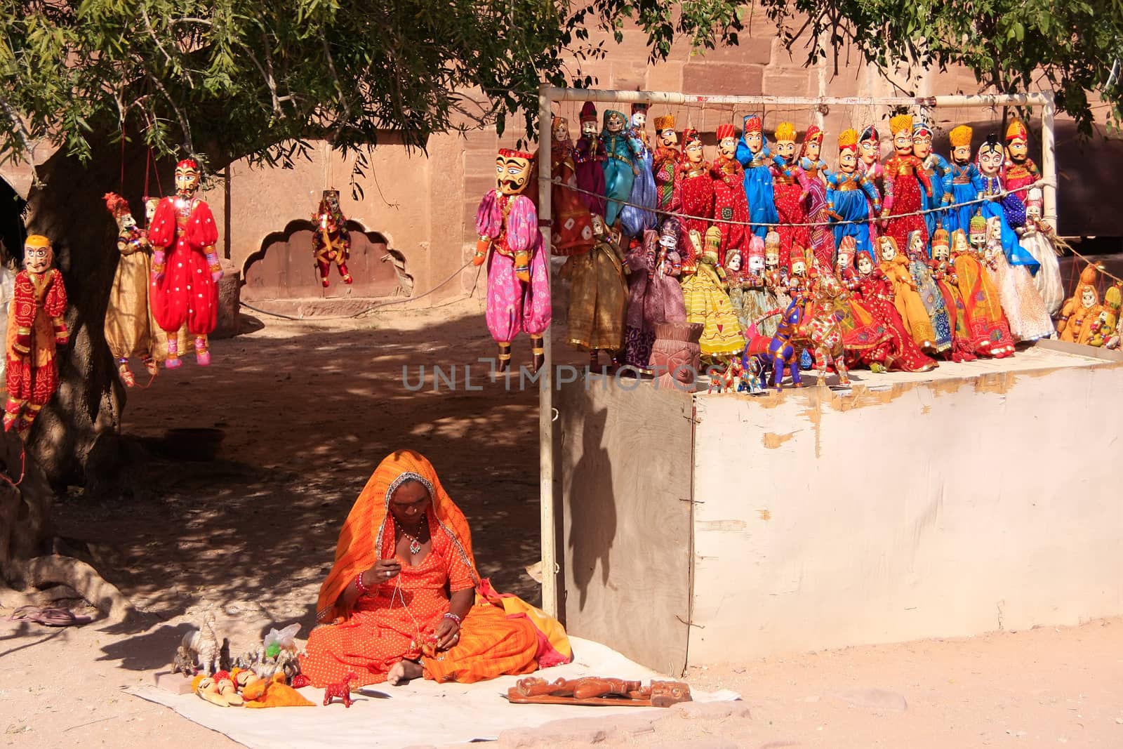 Indian woman selling puppets, Mehrangarh Fort, Jodhpur, India by donya_nedomam