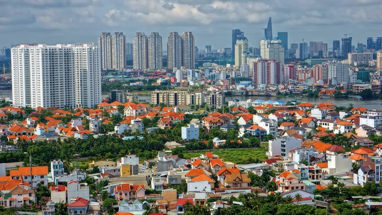 HO CHI MINH CITY ( SAI GON), VIET NAM- SEP 15: Development of mordern city with row of highrise buidling rise up to sky and new urban with villas along river in Ho Chi Minh, Vietnam on Sep 15, 2012