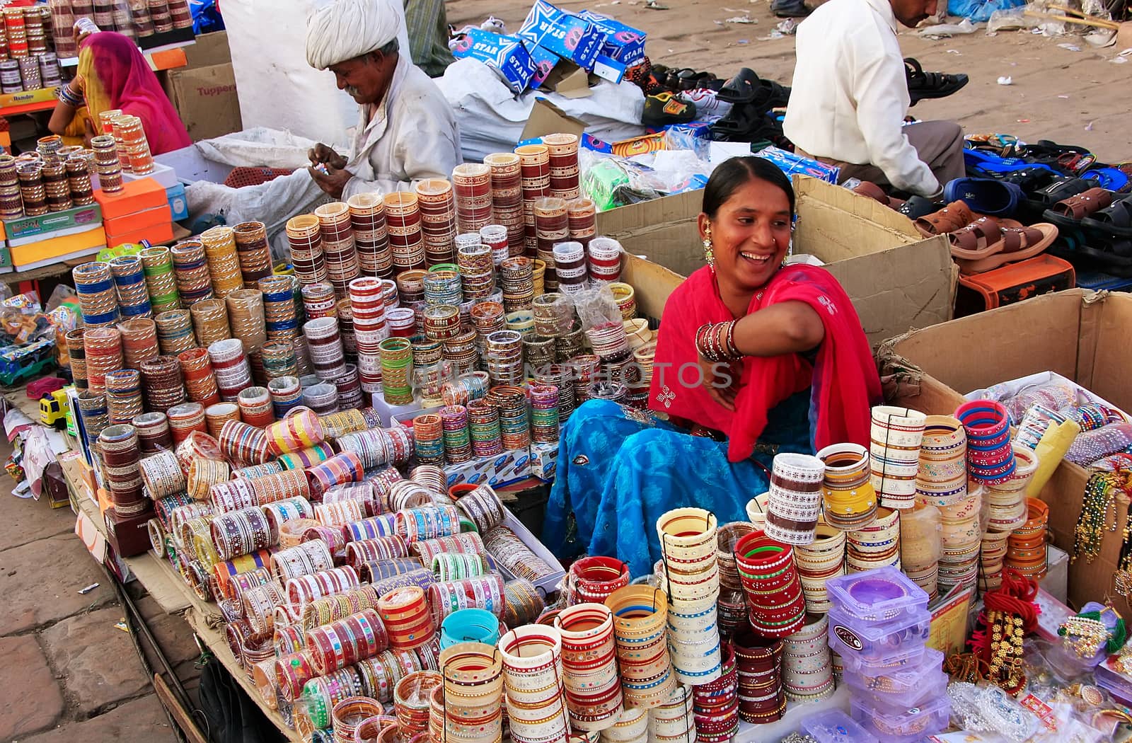 Indian woman selling bangels at Sadar Market, Jodhpur, India by donya_nedomam