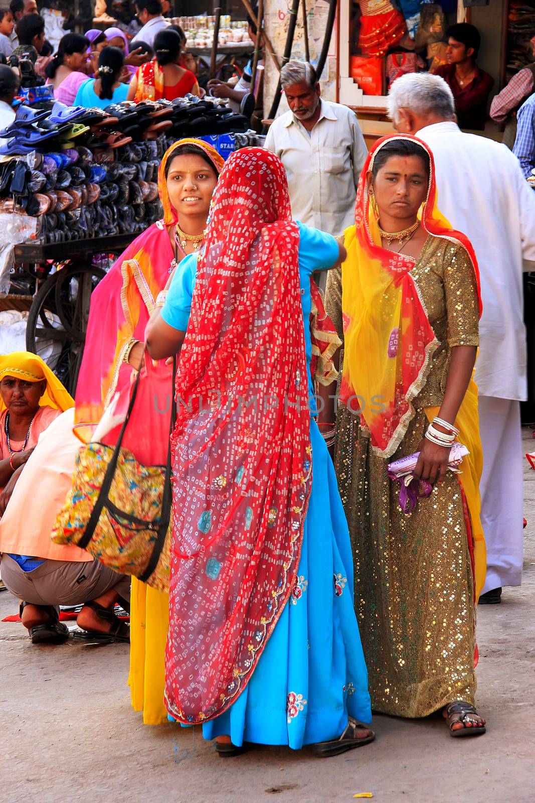 Indian women standing at Sadar Market, Jodhpur, India by donya_nedomam