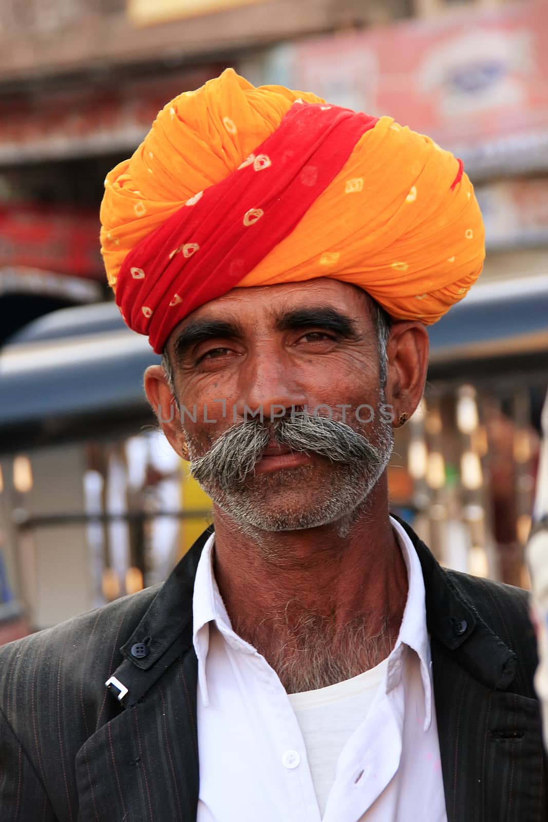 Inidan man walking at Sadar Market, Jodhpur, India by donya_nedomam