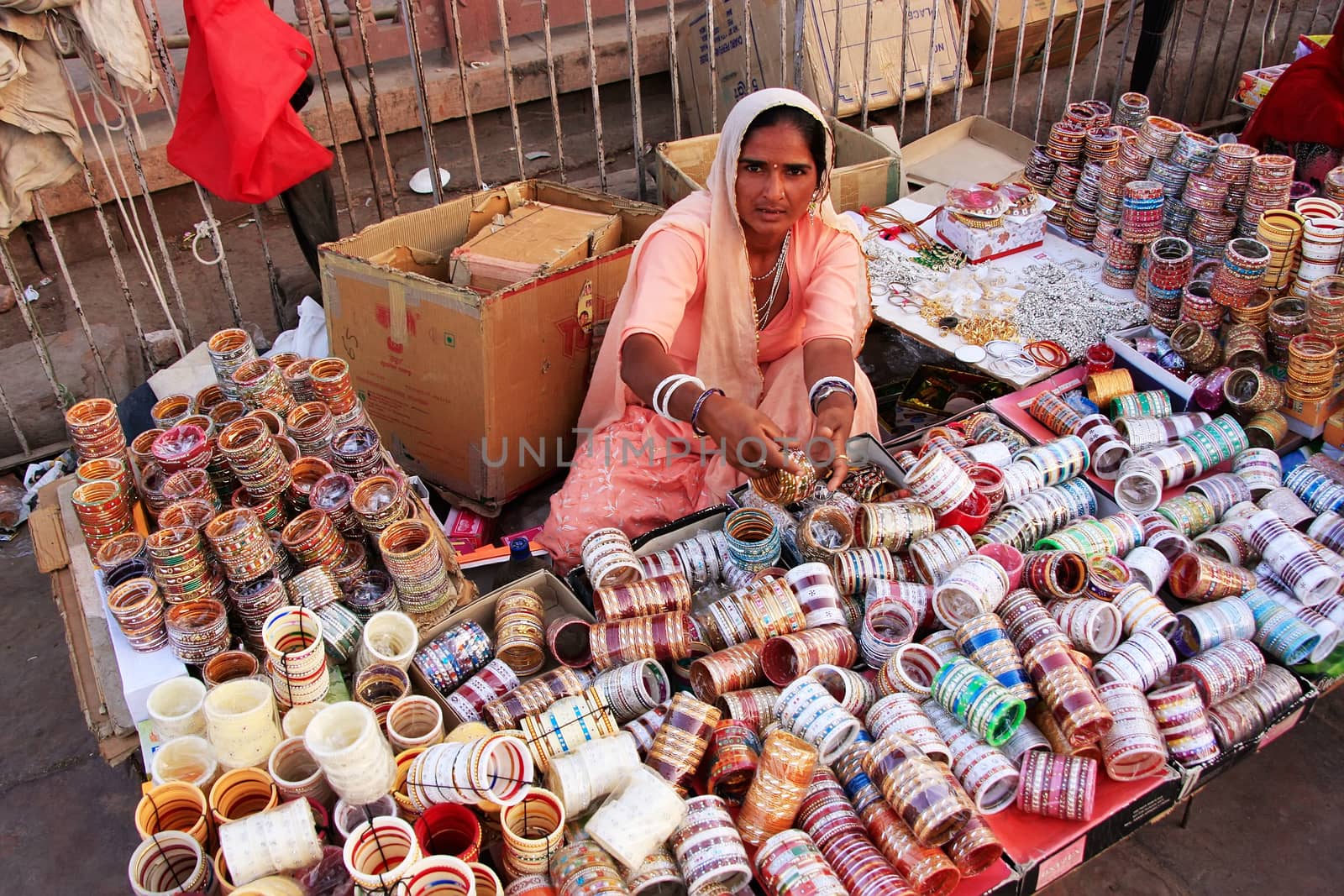 Indian woman selling bangels at Sadar Market, Jodhpur, India by donya_nedomam