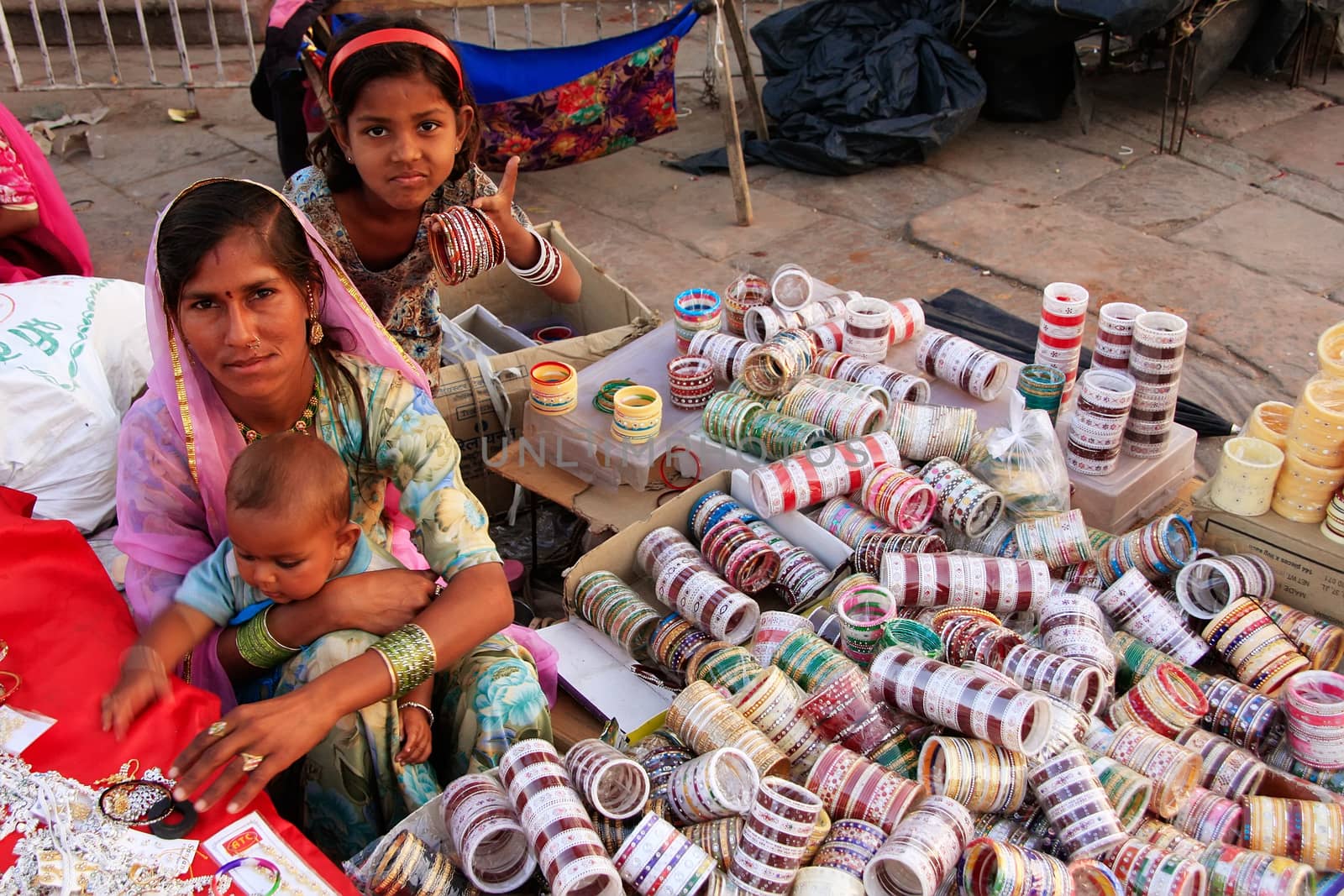 Indian woman selling bangels at Sadar Market, Jodhpur, India by donya_nedomam