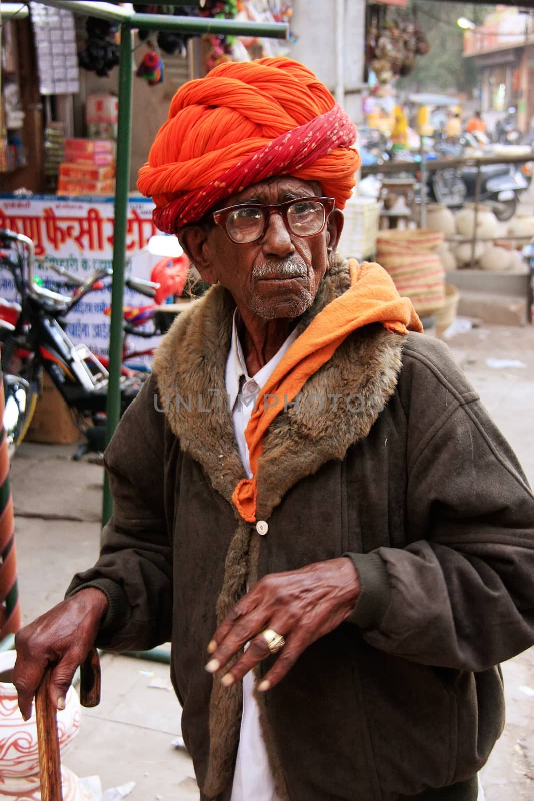 Inidan man walking at Sadar Market, Jodhpur, India by donya_nedomam