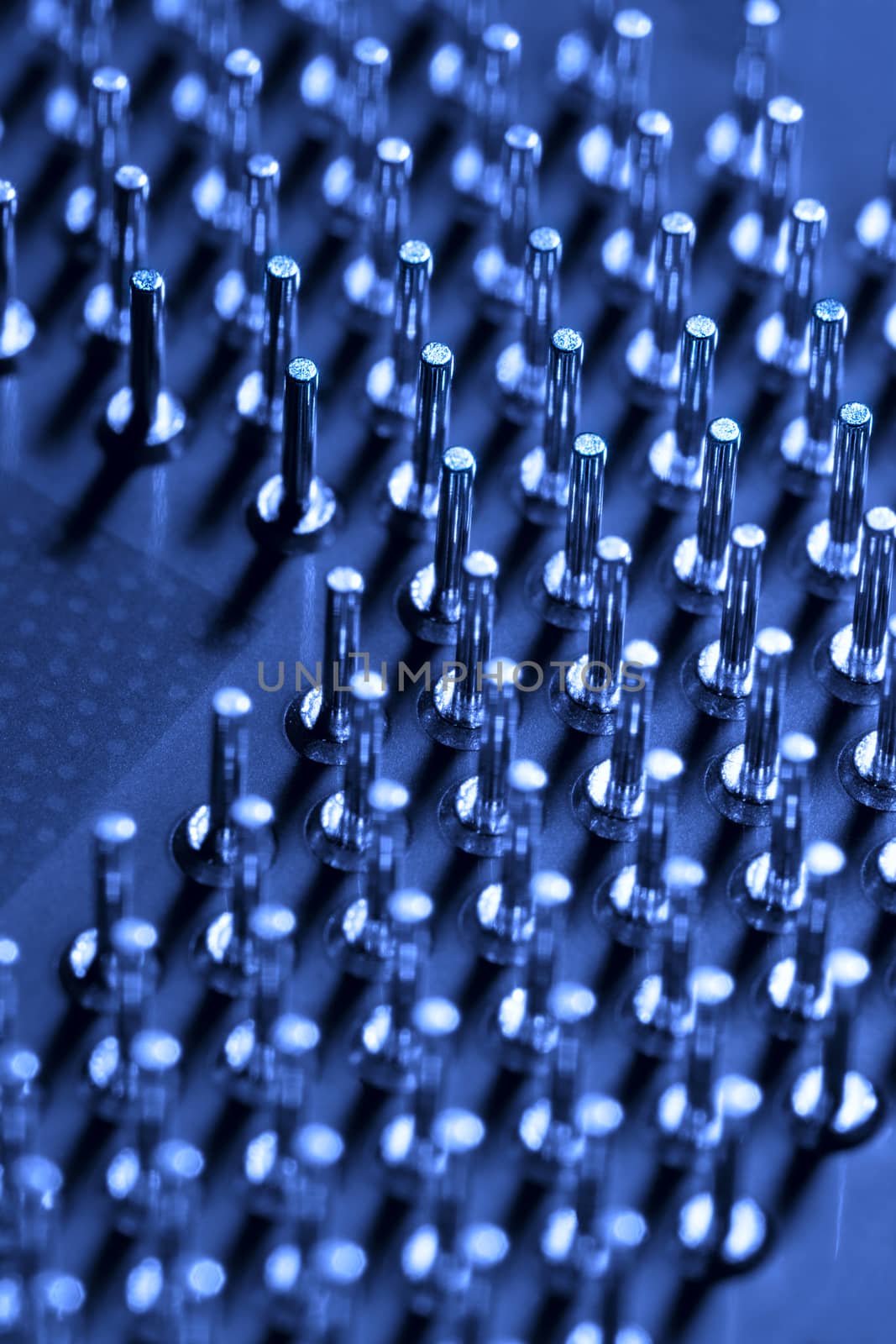closeup of computer processor pins or computer technology blue background