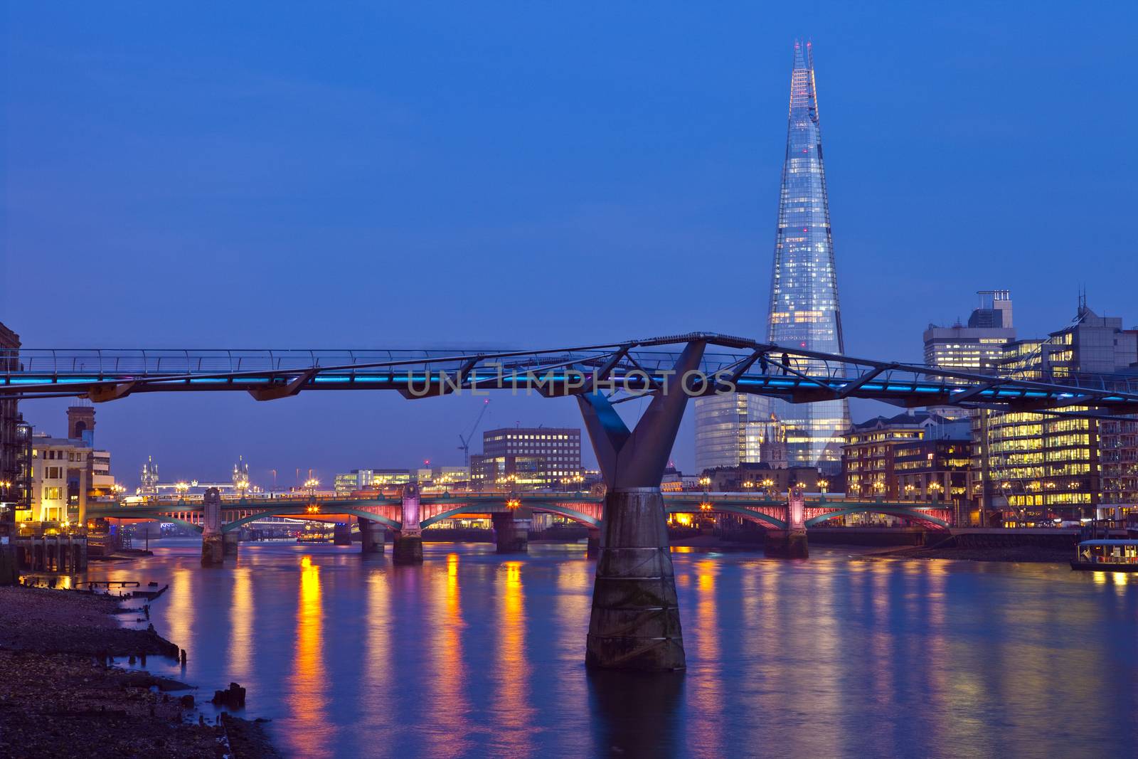 A view of the River Thames with the Shard, Millennium Bridge, Blackfriars Bridge and Tower Bridge in the distance.