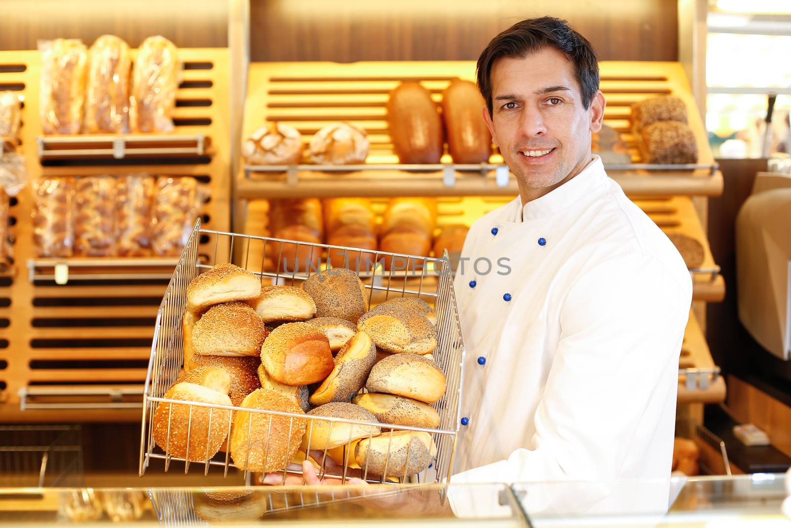 Shopkeeper presents a breadbasket to customer