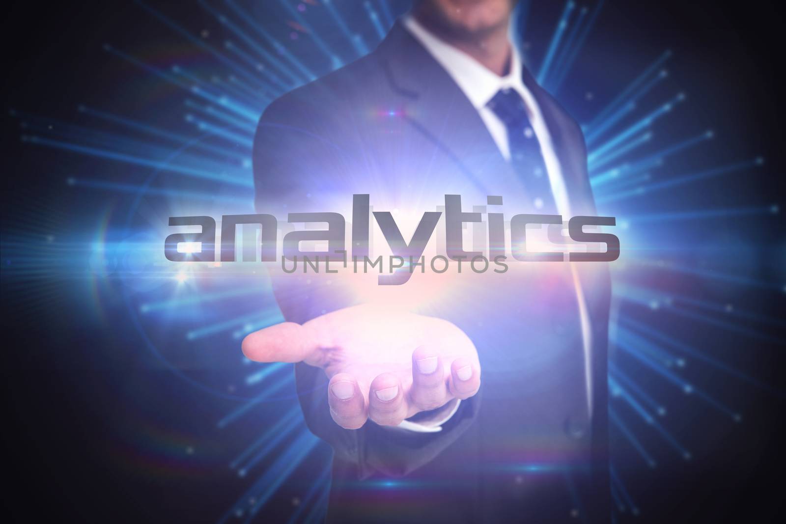 The word analytics and businessman presenting against abstract technology background