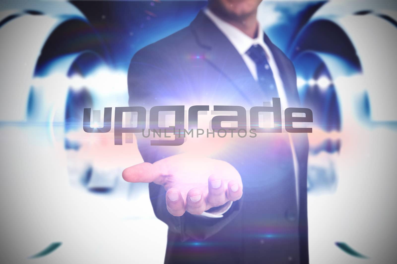 The word upgrade and businessman presenting against abstract cloud design in futuristic structure