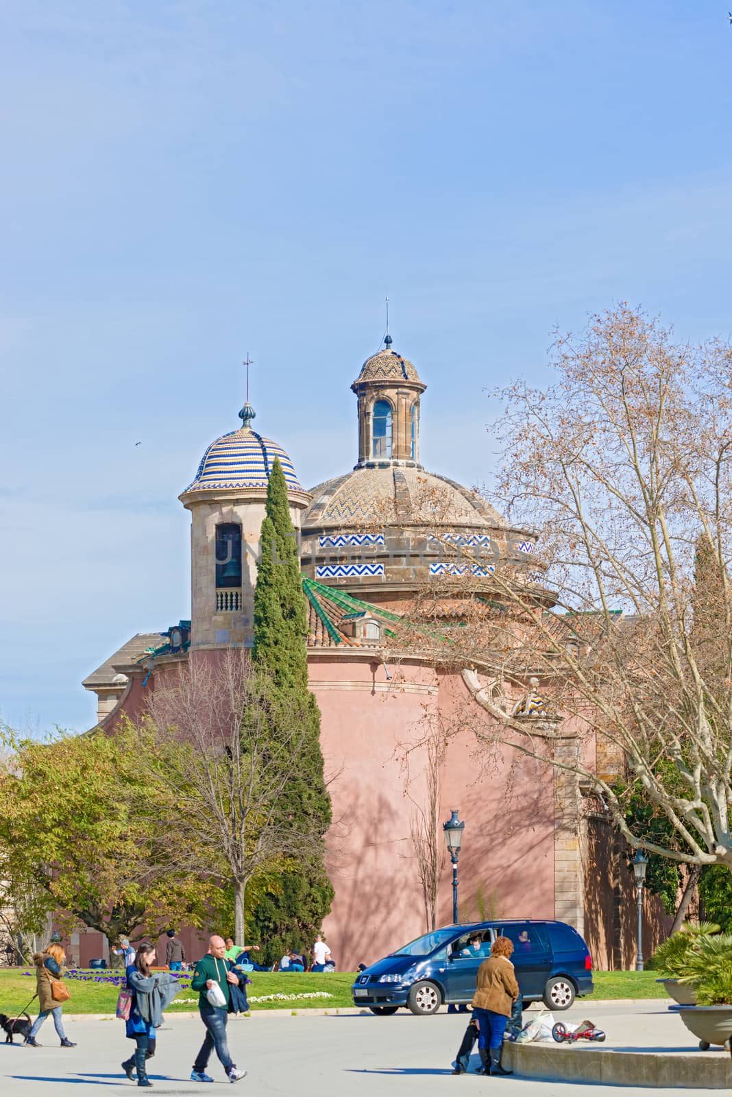 Barcelona, Spain - January 26, 2014: People walking in  Parc de la Ciutadella  in Barceloan, Spain on a sunny day.