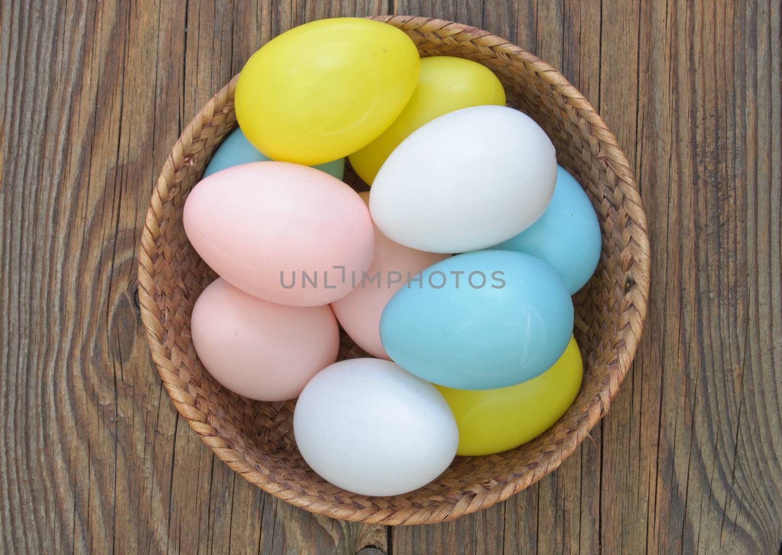 Easter eggs inside a wicker basket 