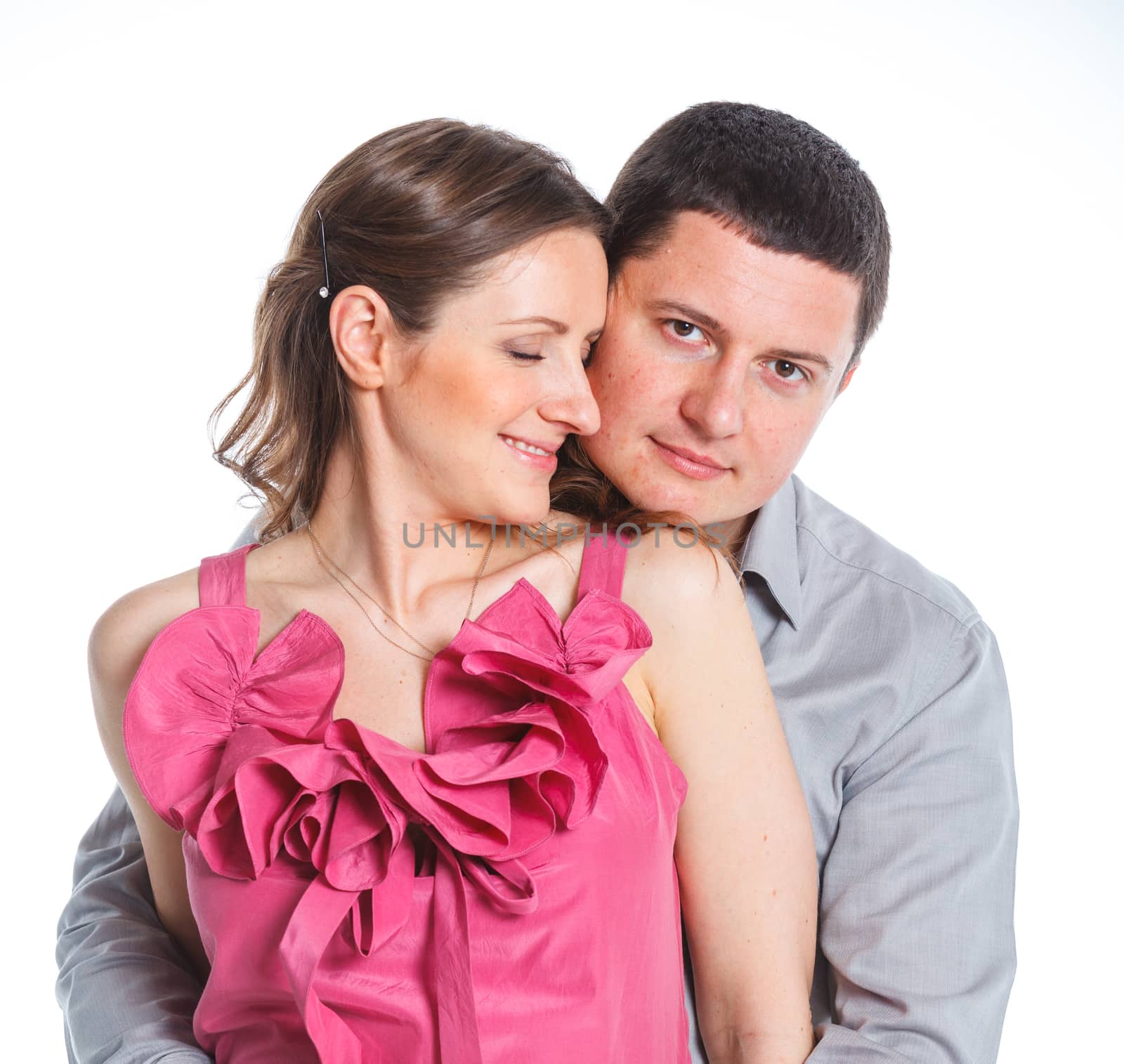 Portrait of happy couple. Attractive man and woman being playful. Isolated on white background.