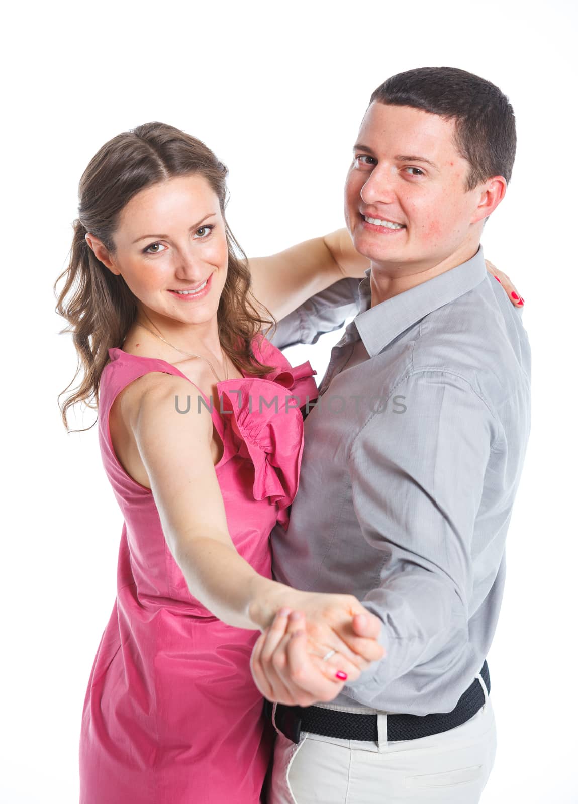 Portrait of happy couple. Attractive man and woman being playful. Isolated on white background.