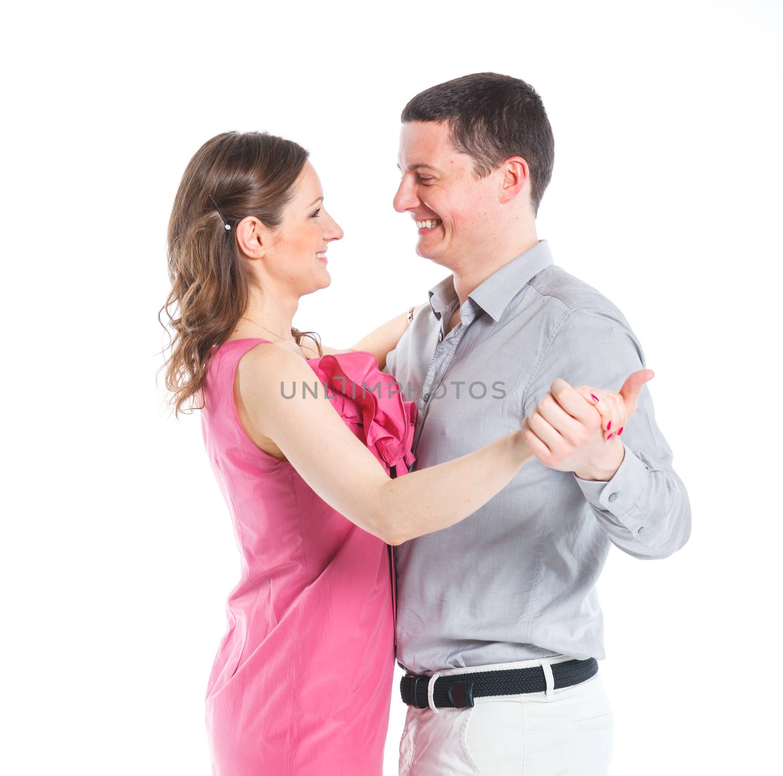 Portrait of happy couple. Attractive man and woman being playful. Isolated on white background.