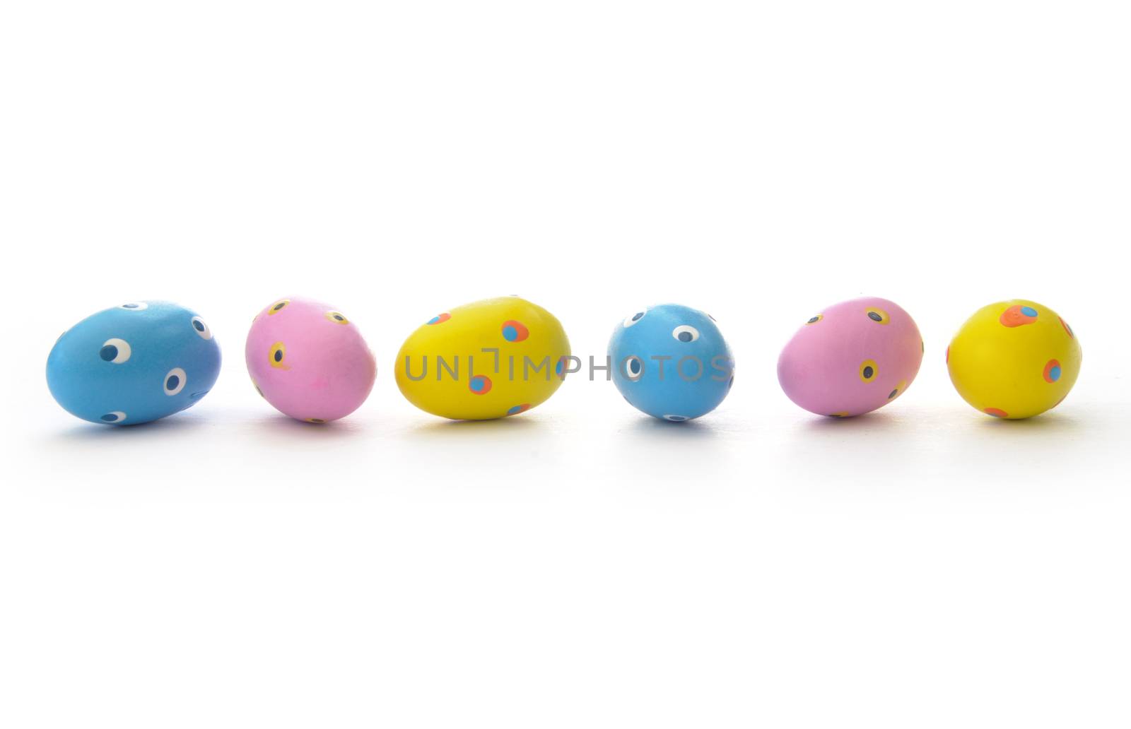 Closeup of painted easter eggs on a white background