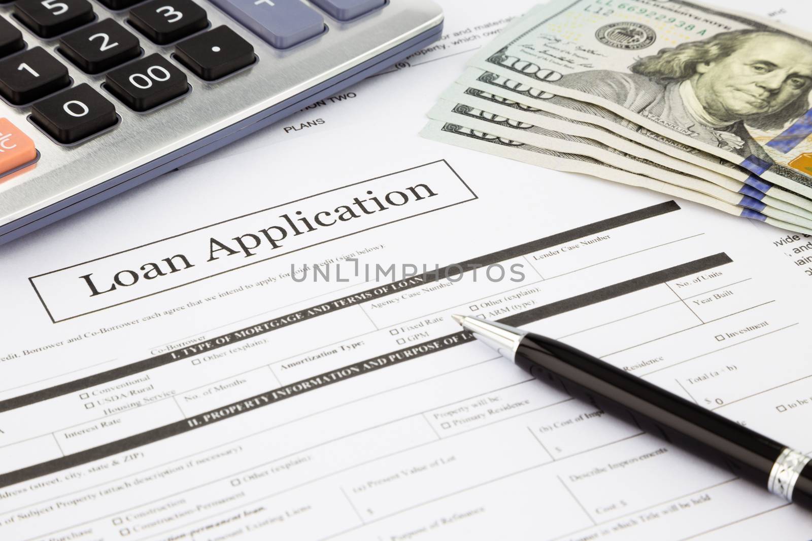loan application form and dollar banknotes by vinnstock