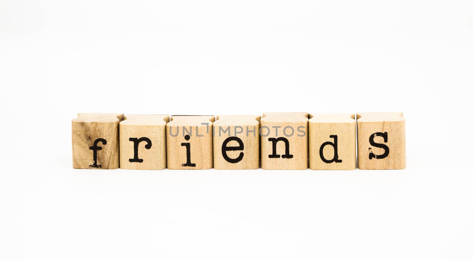 closeup friends wording isolate on white background, companion and relationship concept and idea.