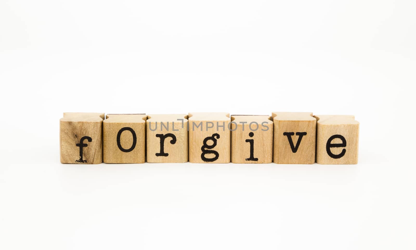 closeup forgive wording isolate on white background, ethic and merit concept and idea