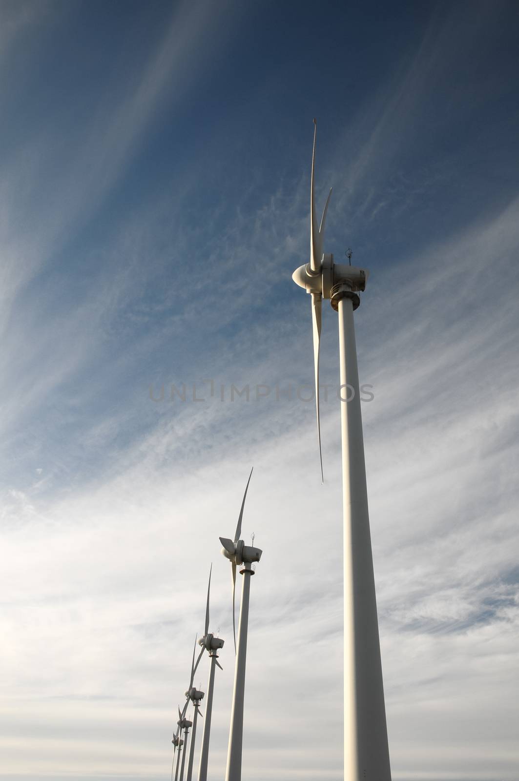 Eletric Power Generator Wind Turbine over a Cloudy Sky