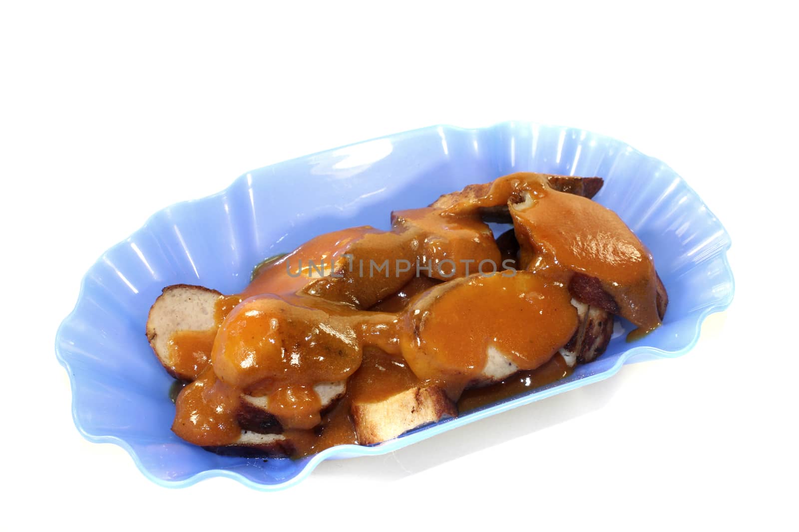 Sausage with curry on a light background