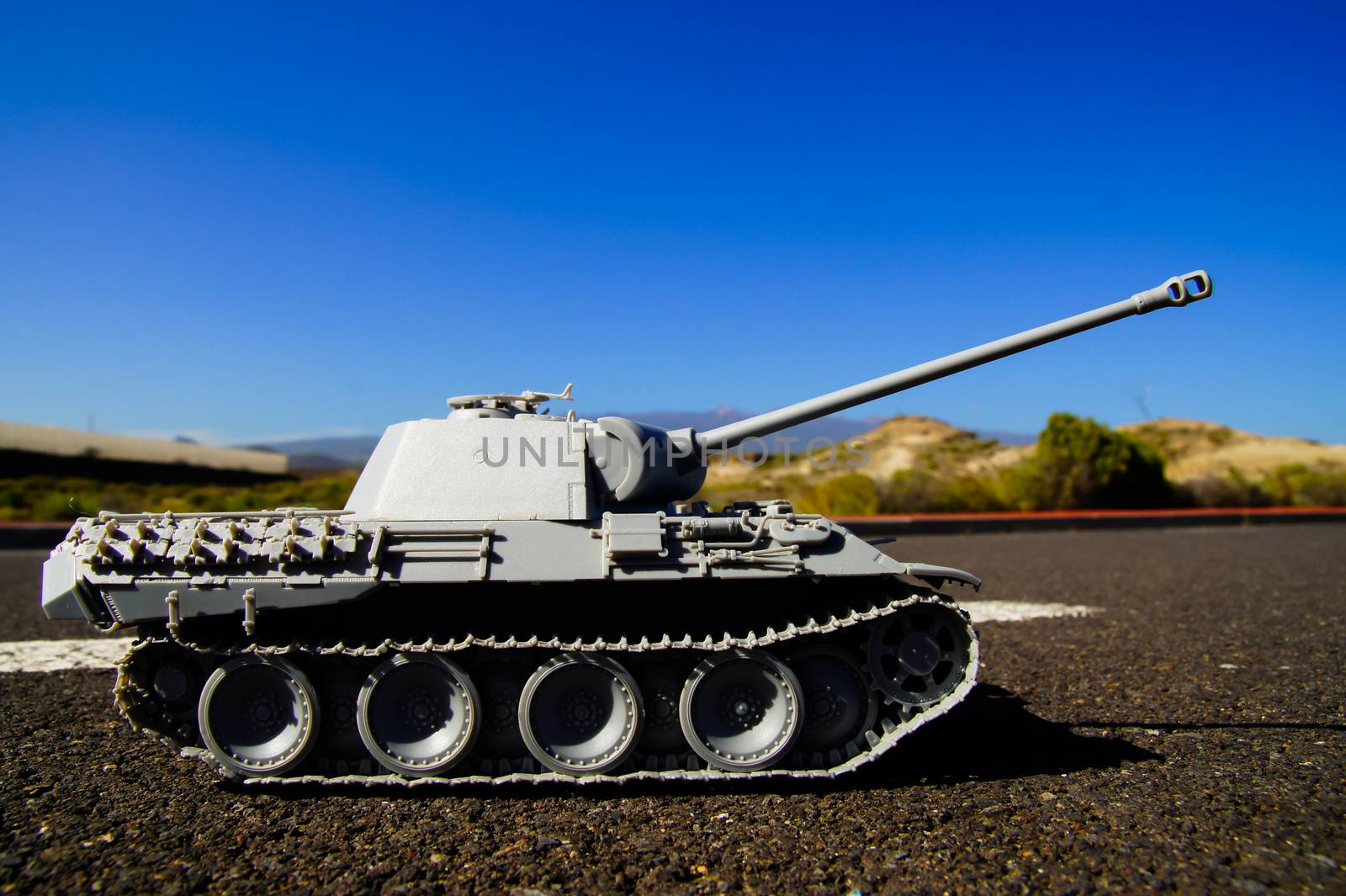 Modern War Concept Model Tank in the Middle of an Asphalt Road
