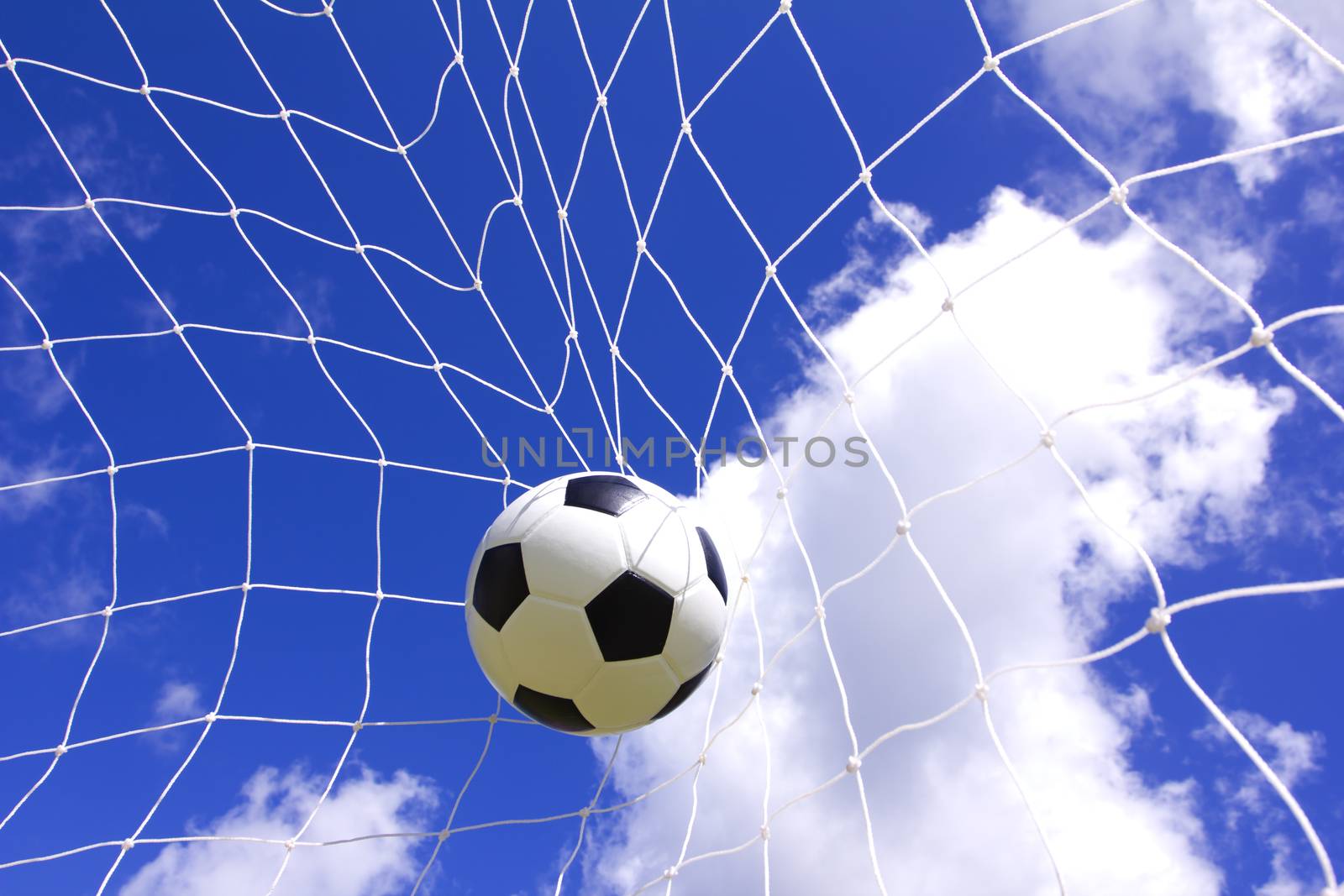 Soccer football in Goal net by wyoosumran