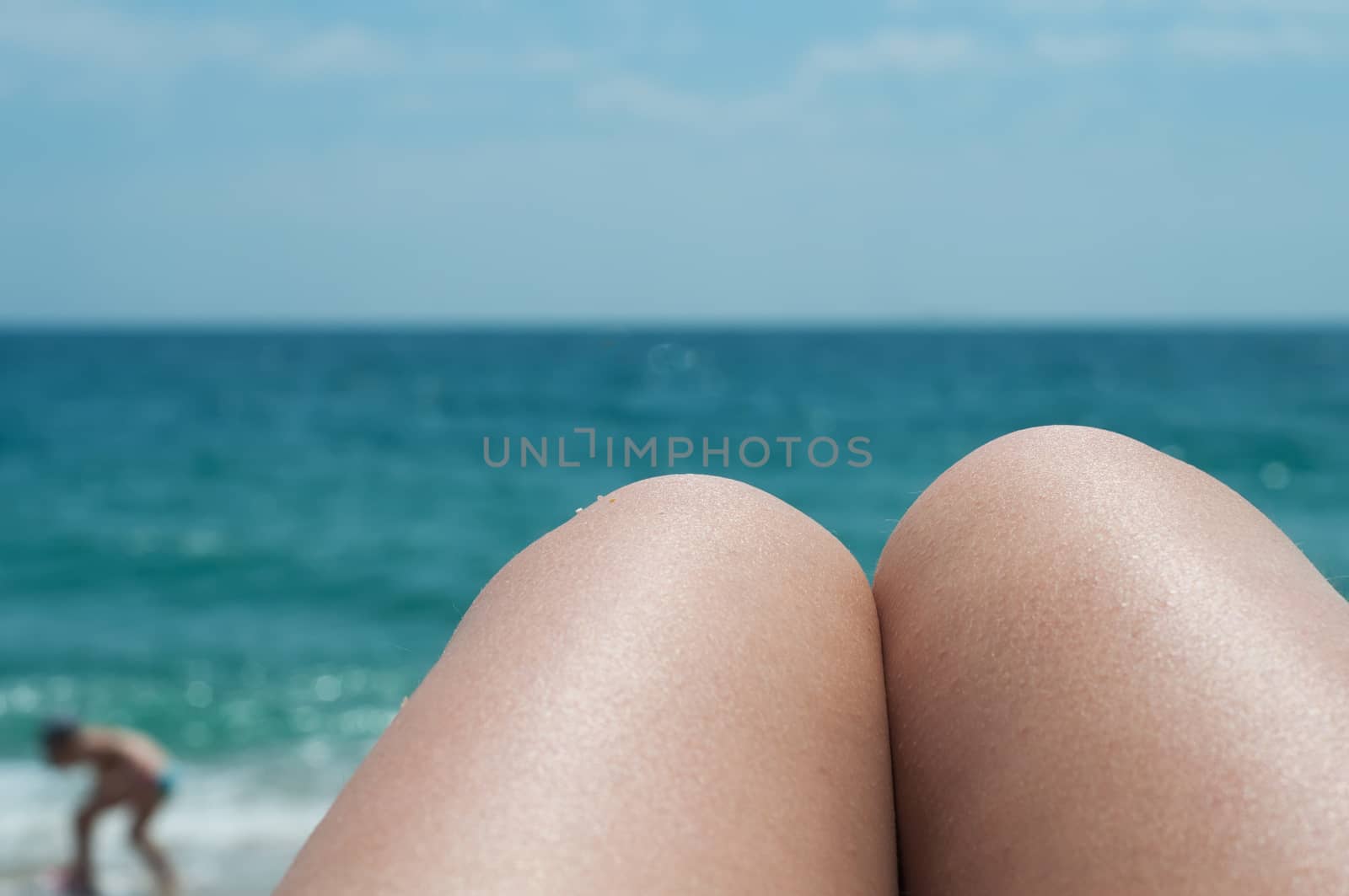 Summer shot of legs on the beach