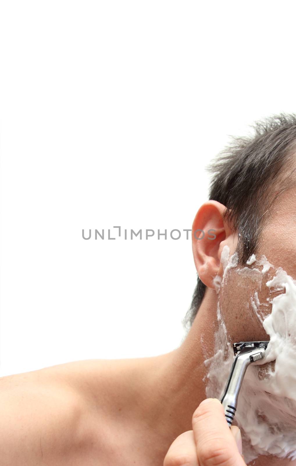 closeup of a man shaving over white