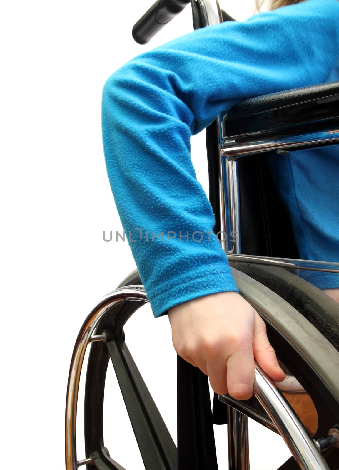 closeup of a kid in a wheel chair