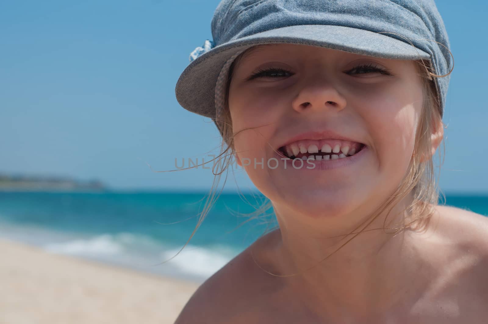 Cute little girl in denim cap by anytka