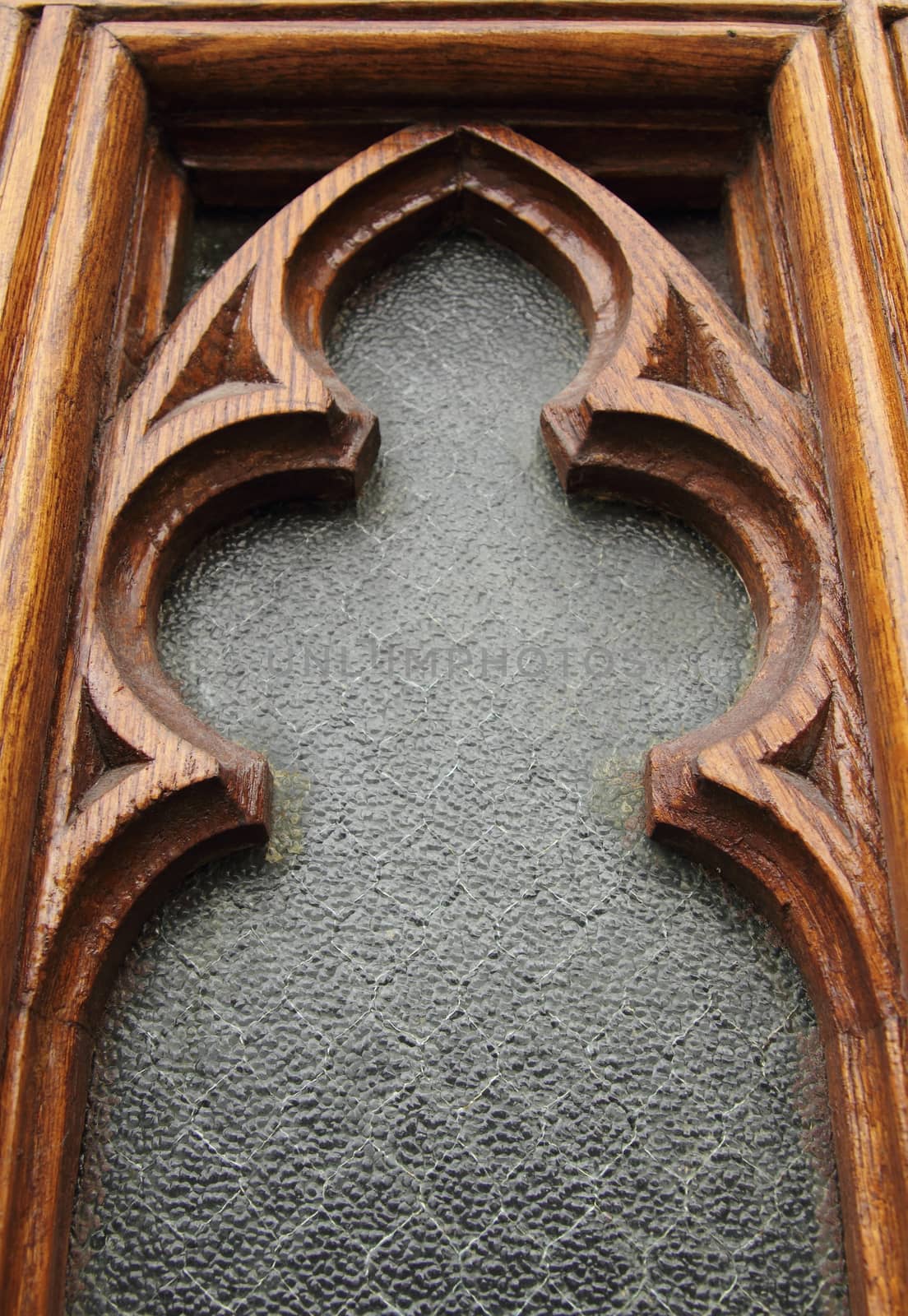 closeup of a church window with wood frame