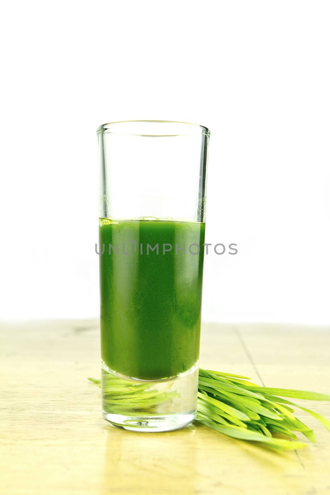 Shot glass of fresh wheatgrass 