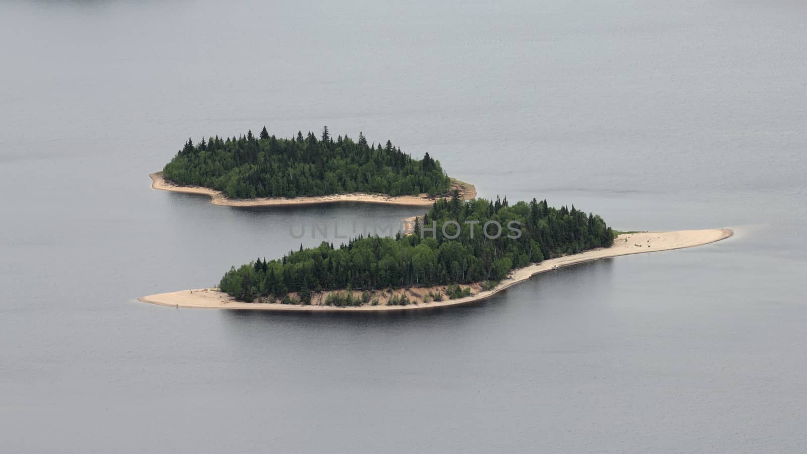 two wild islands on a lake taken from a plane