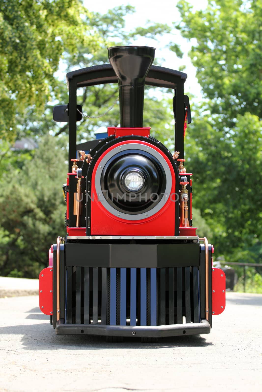 front view of a red and black locomotive