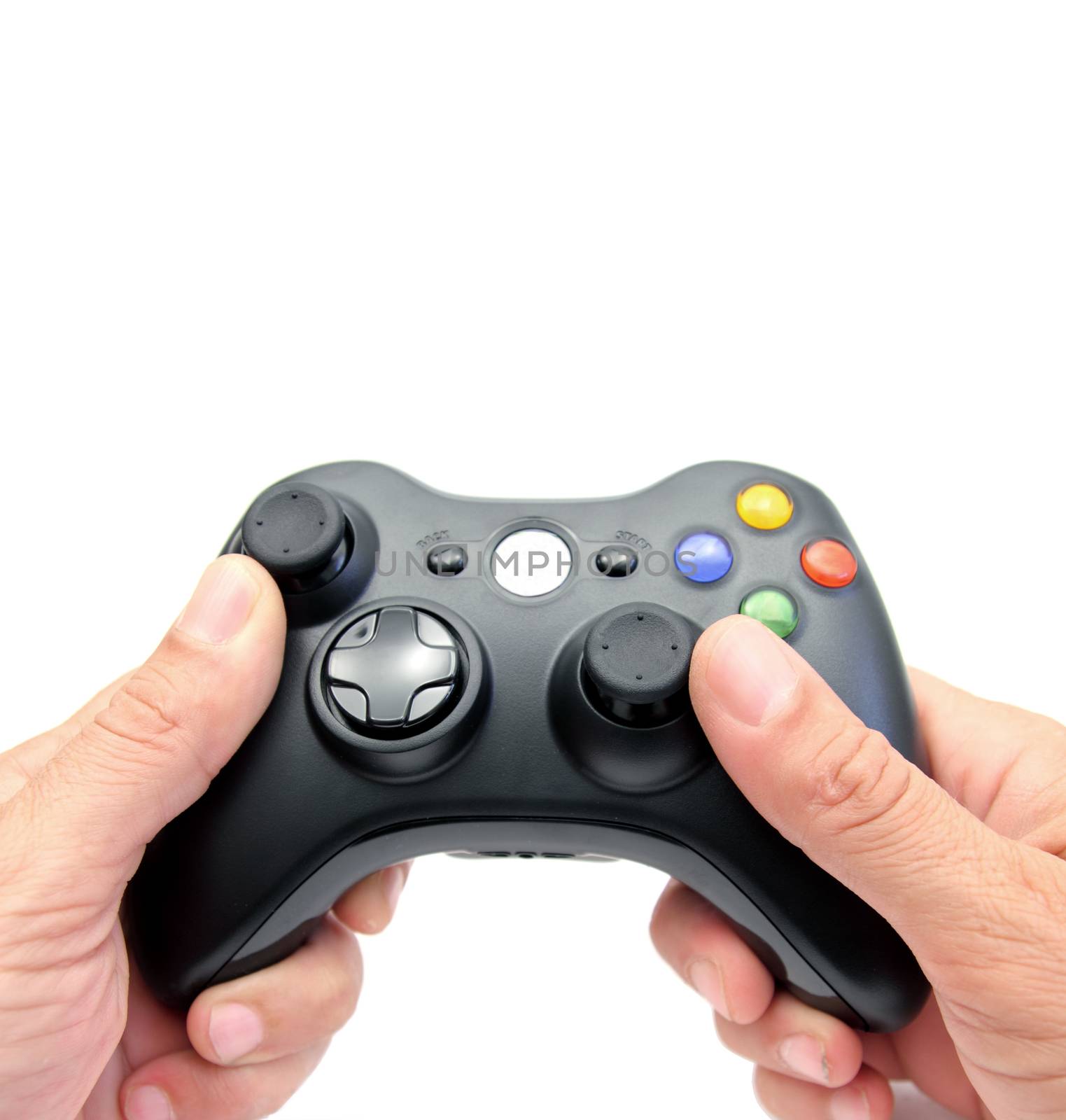 closeup of two hands holding a videogame controller