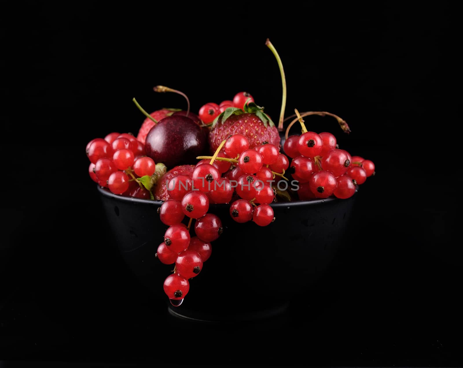 fresh red  fruit on black background by sette