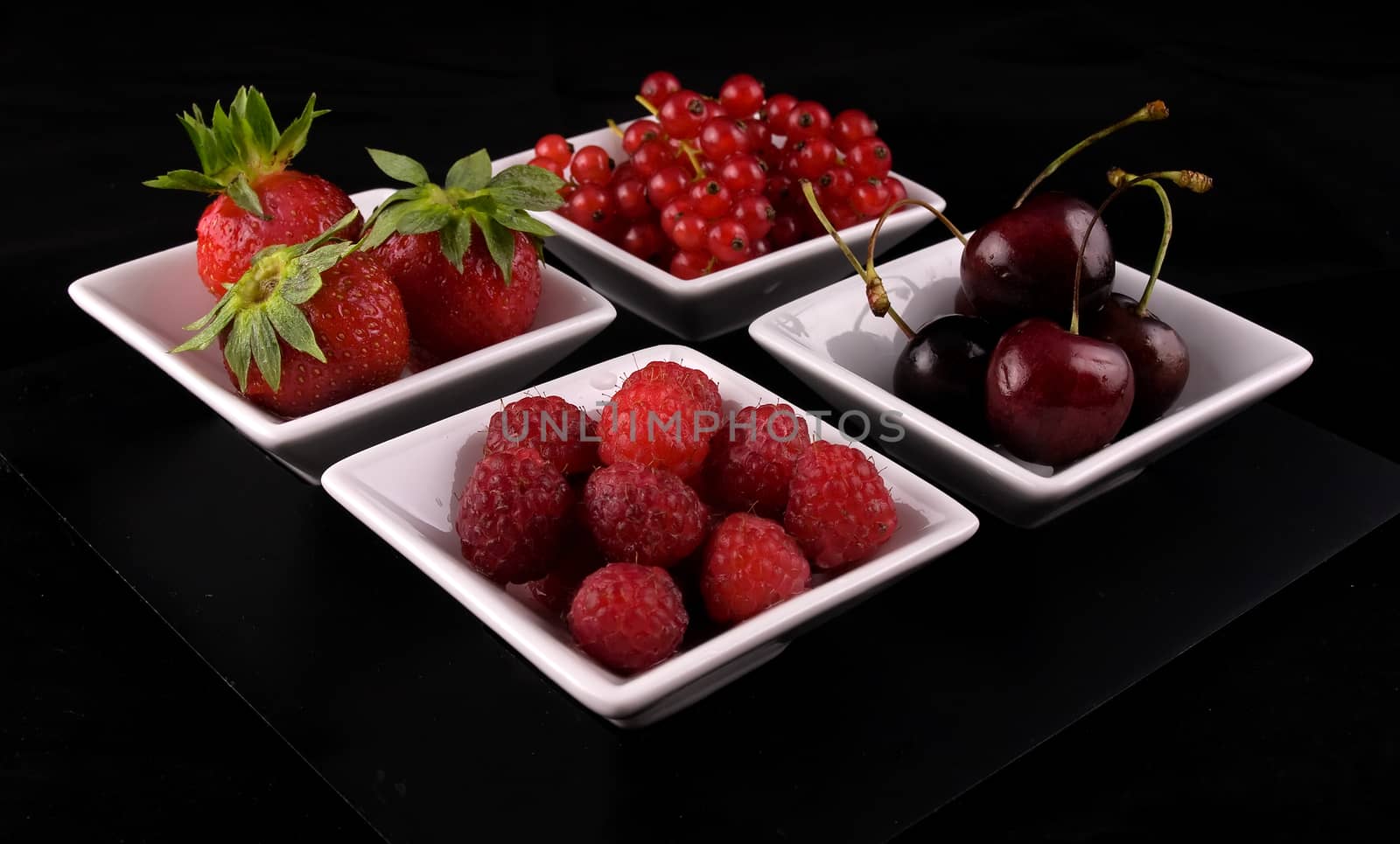 fresh red  fruit on black background