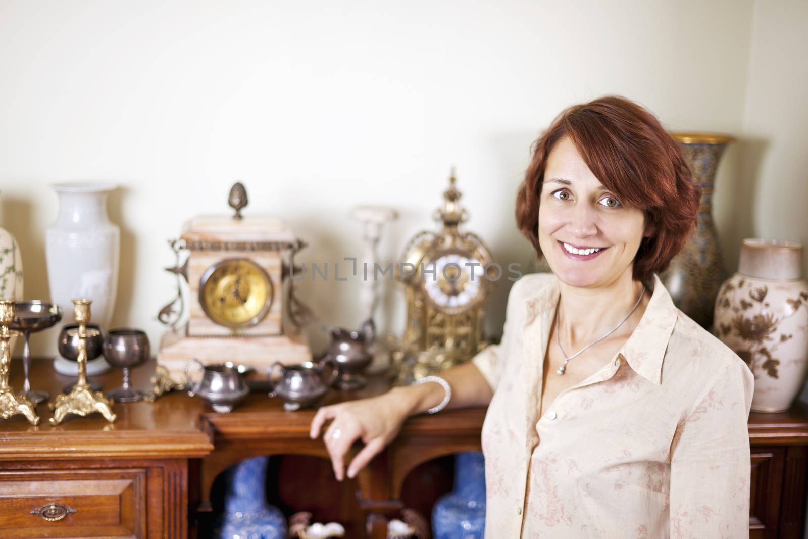 Woman with antique collection by elenathewise