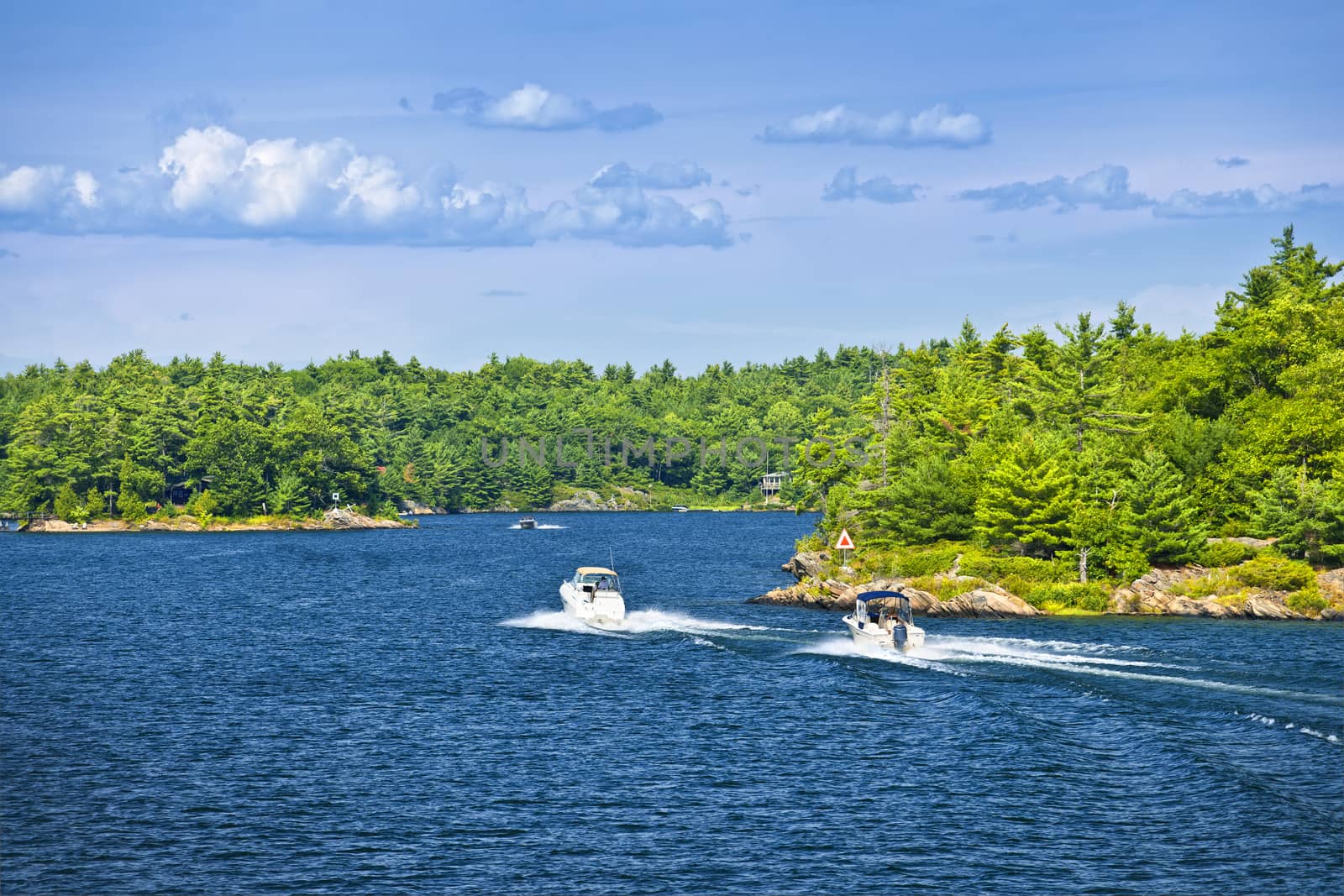 Recreational boats on blue waters of Georgian Bay near Parry Sound, Ontario Canada