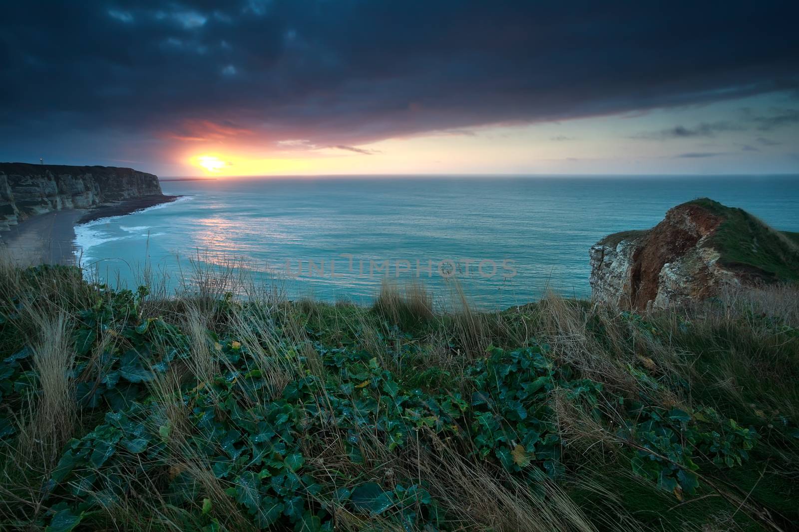 sunset over Atlantic ocean and cliffs, Etretat, Normandy, France