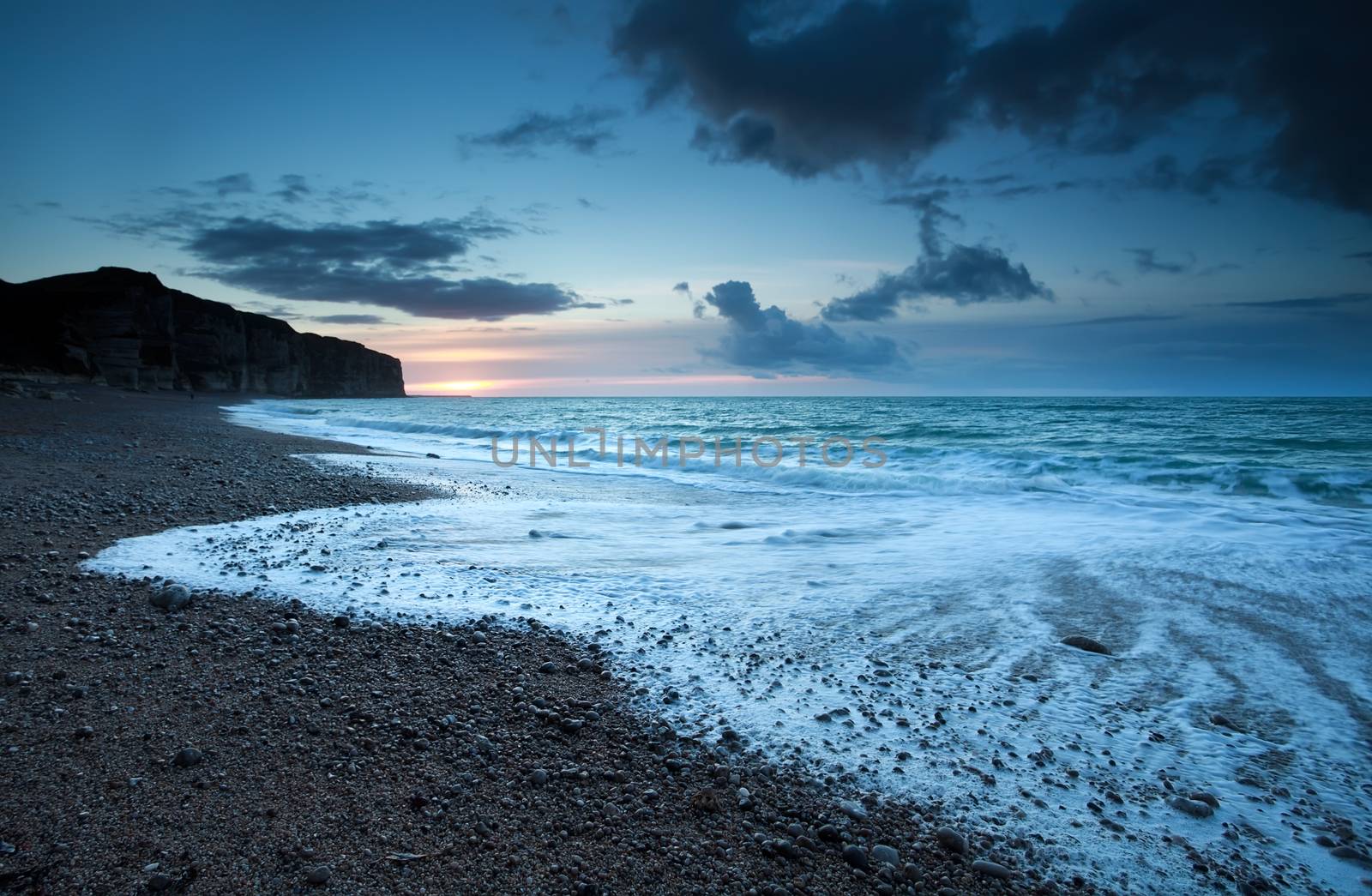 Atlantic ocean coast in dusk, Normandy, France