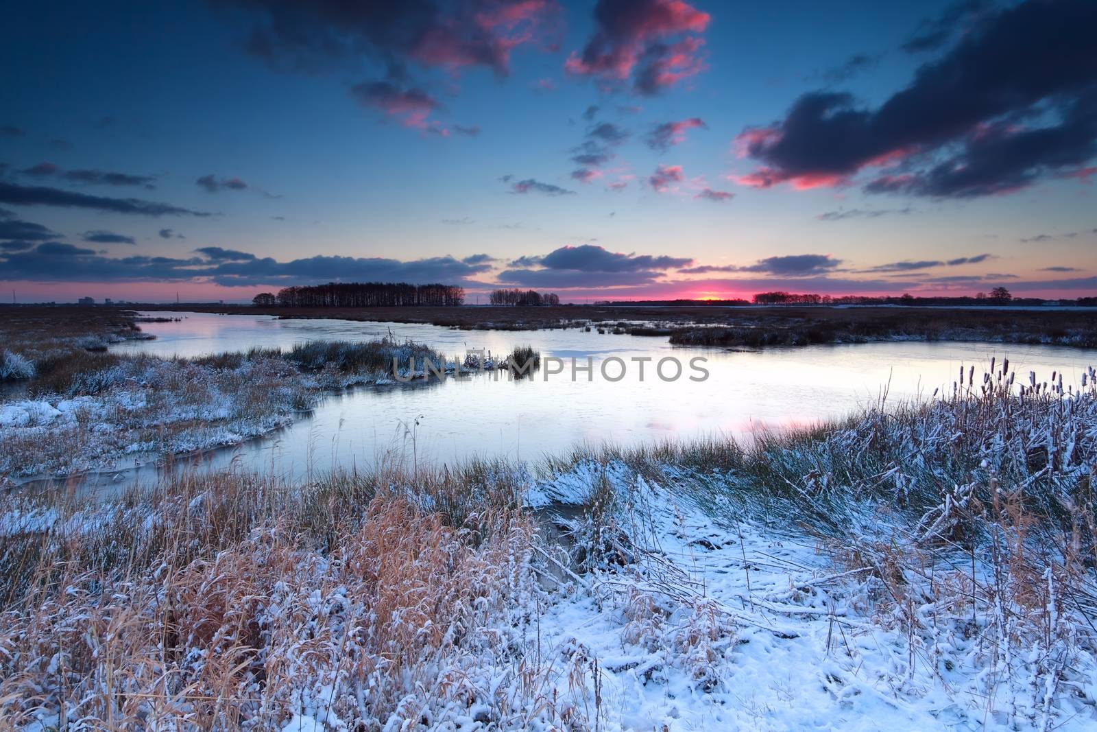 winter sunrise over river in snow, Onlanden, Drenthe, Netherlands